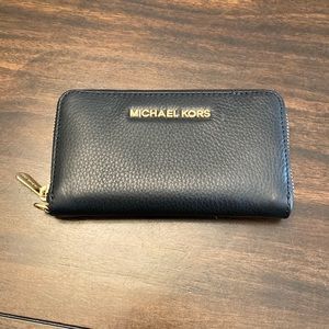 Black zippered Michael Kors wallet
